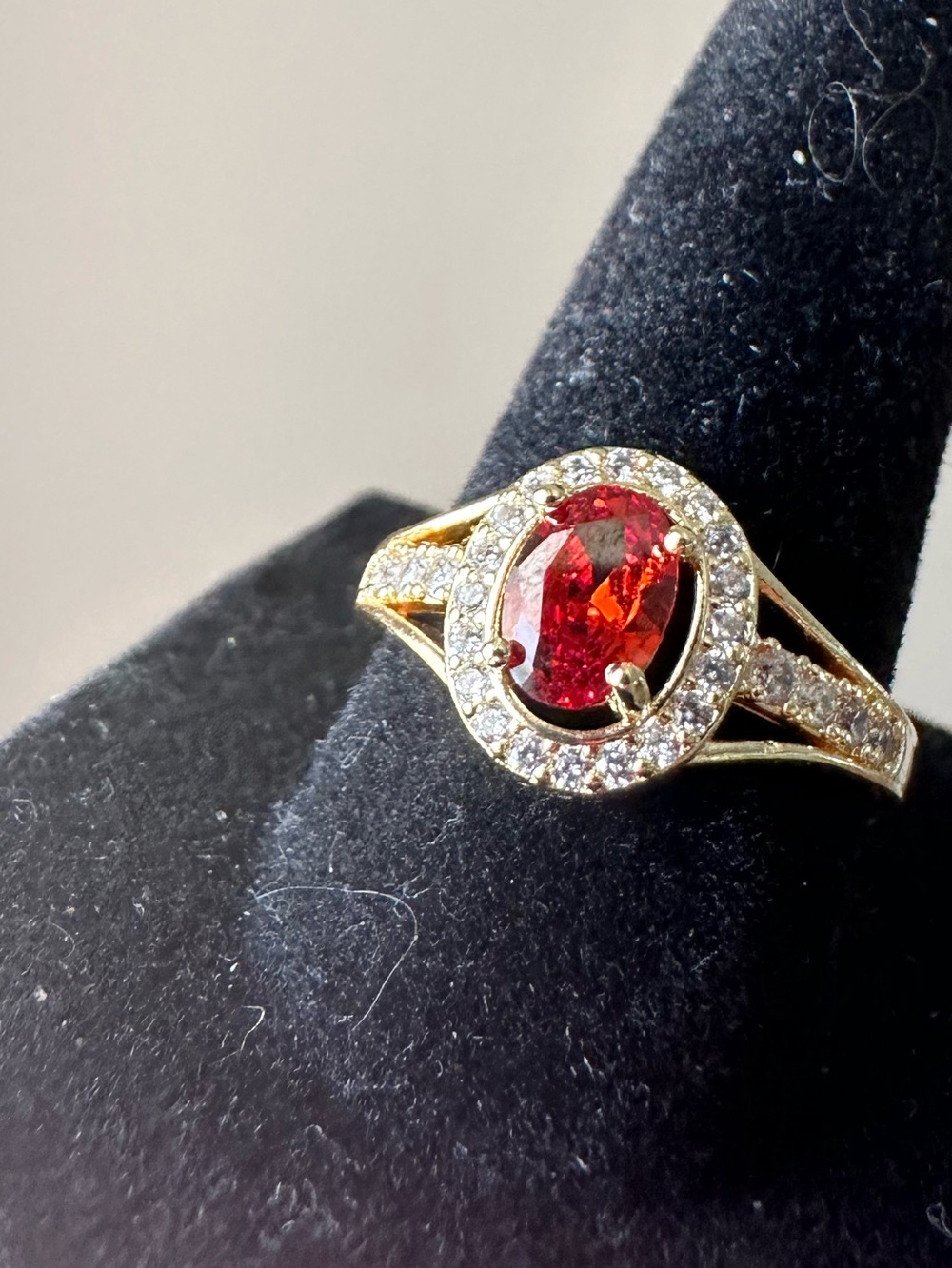 18k Yellow Gold Plated Ring with Red Oval Gemstone and Halo Accents